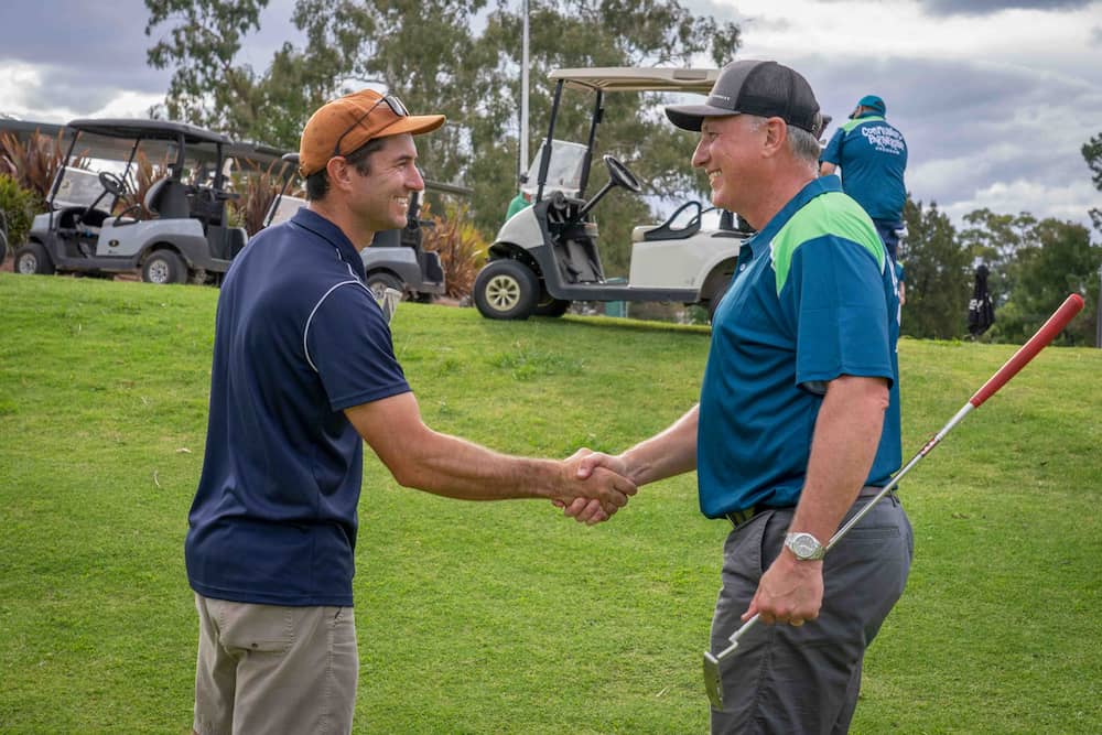 David Heine shaking hands after golf day