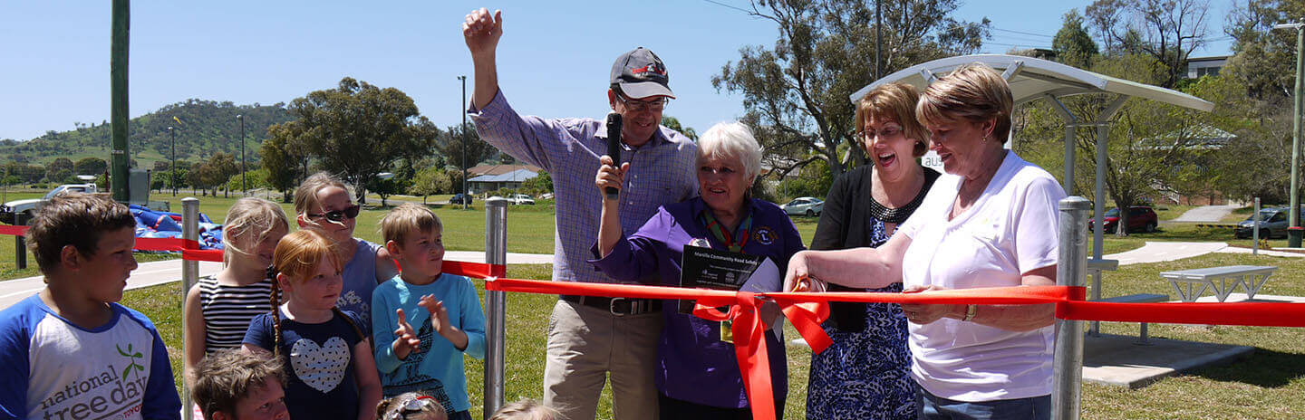 Park opening by cutting a red ribbon